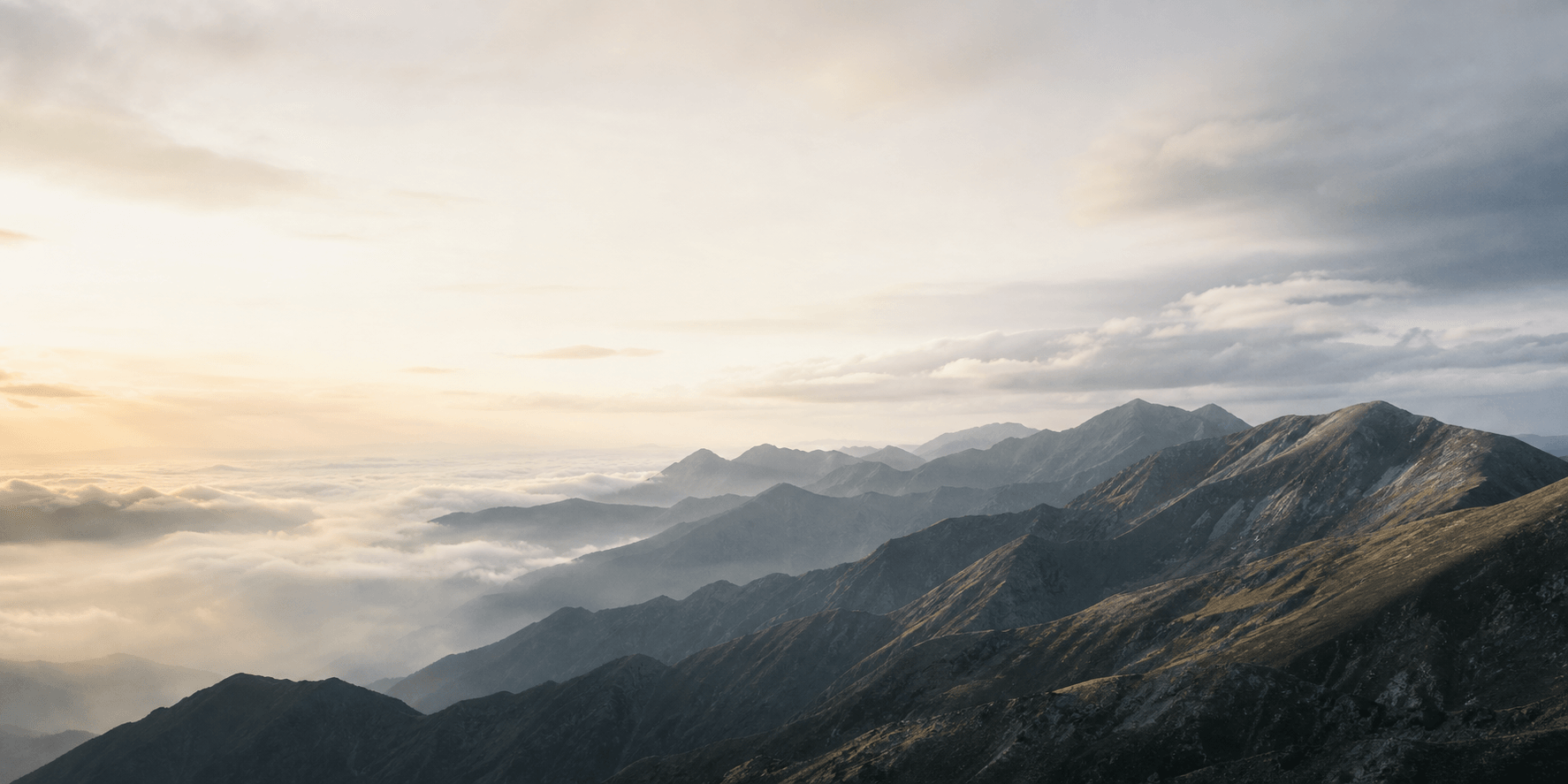 Cloud-filled mountain valleys at dawn